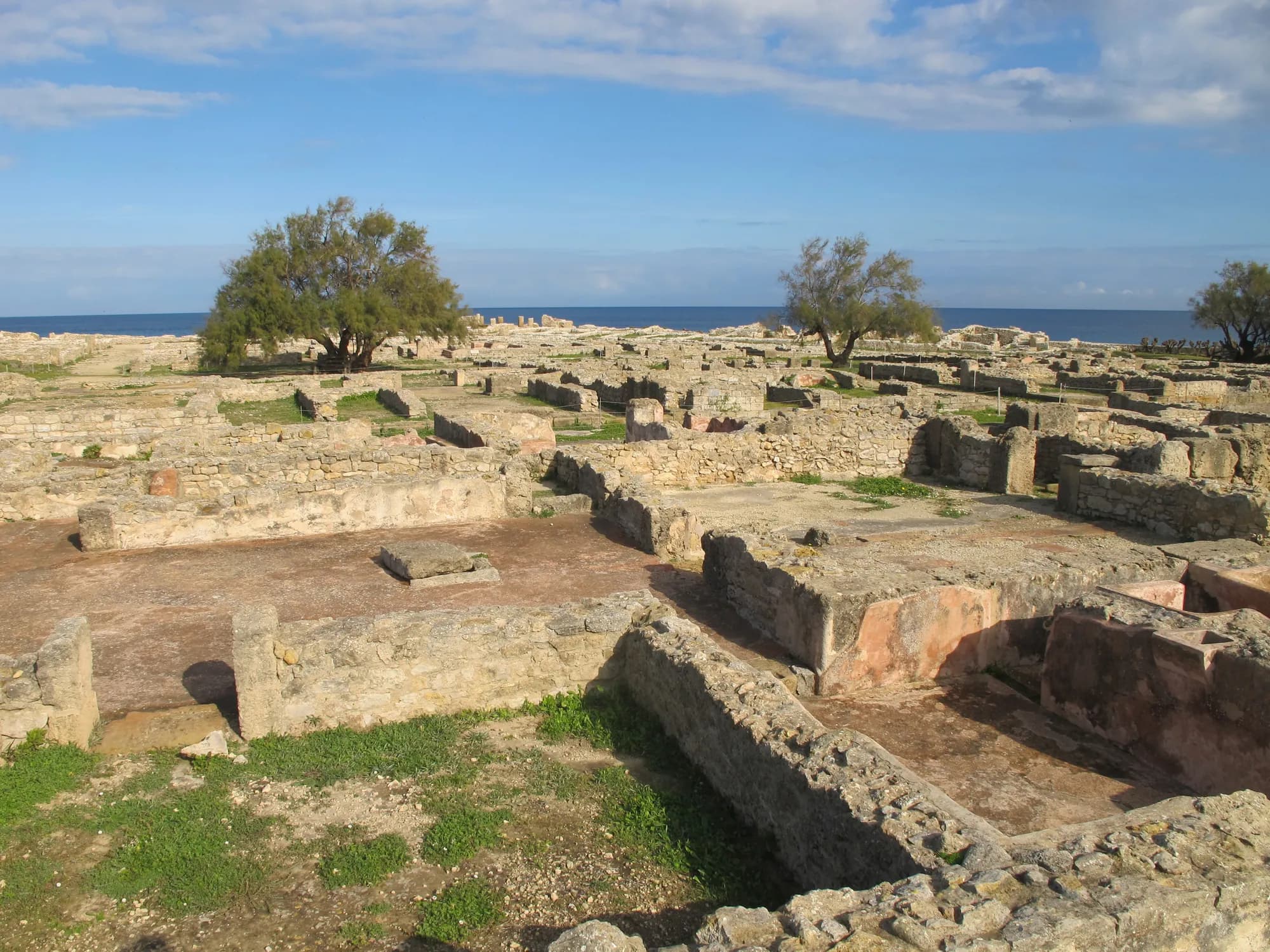 Low walls of the Punic houses of Kerkouane above the sea