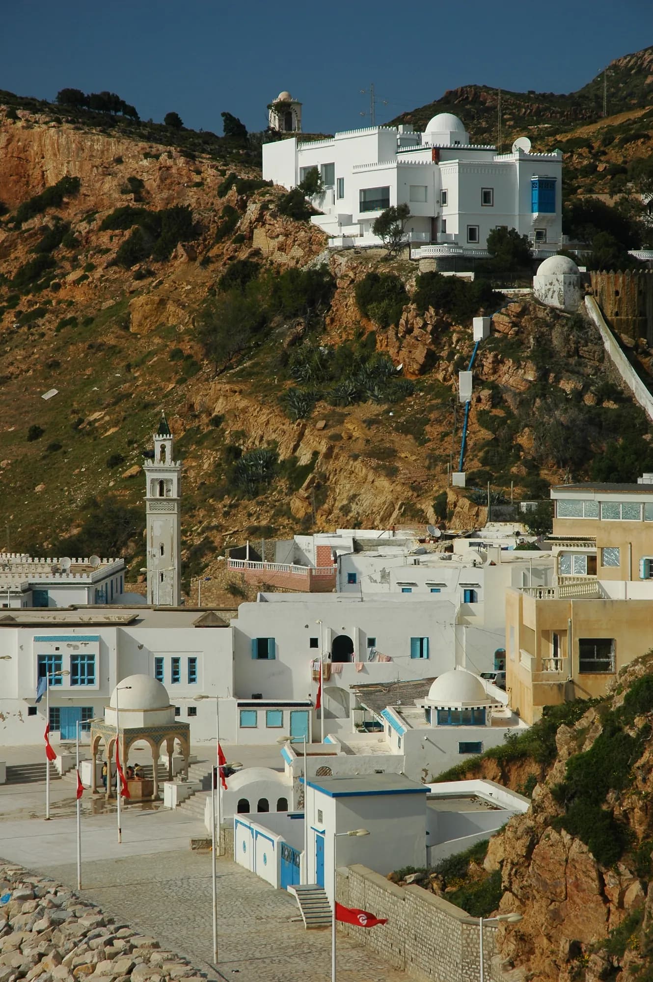 White houses of Korbous between the cliff and the sea